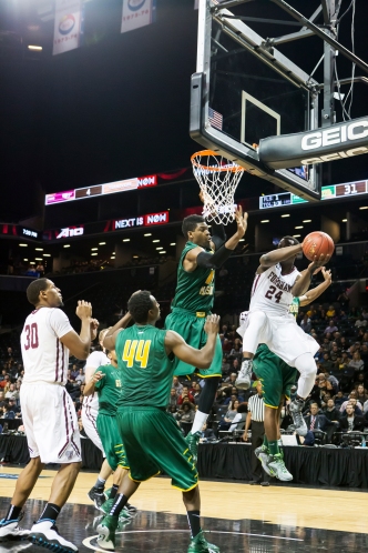 Bryan Smith attempts to get past George Mason's defense the A-10 Tournament. Christian Wiloejo/The Fordham Ram